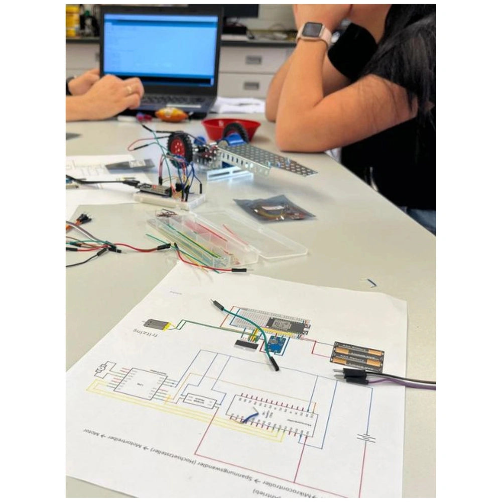 Eitech Speed Racer construction set featuring plastic case, metal components, and colorful circuit boards in a close-up view.