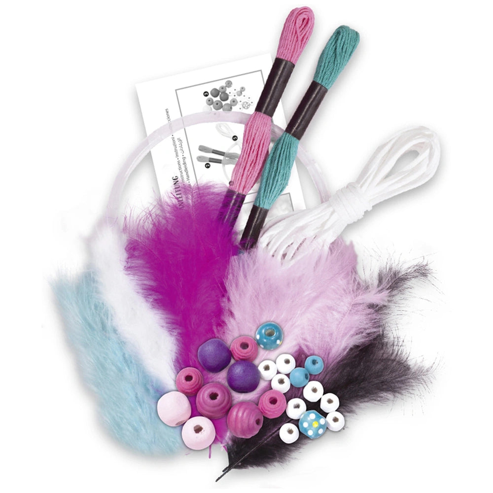 Folia Dreamcatcher Set featuring purple feather, colorful pom poms, various yarns, and beads arranged on white and black pape