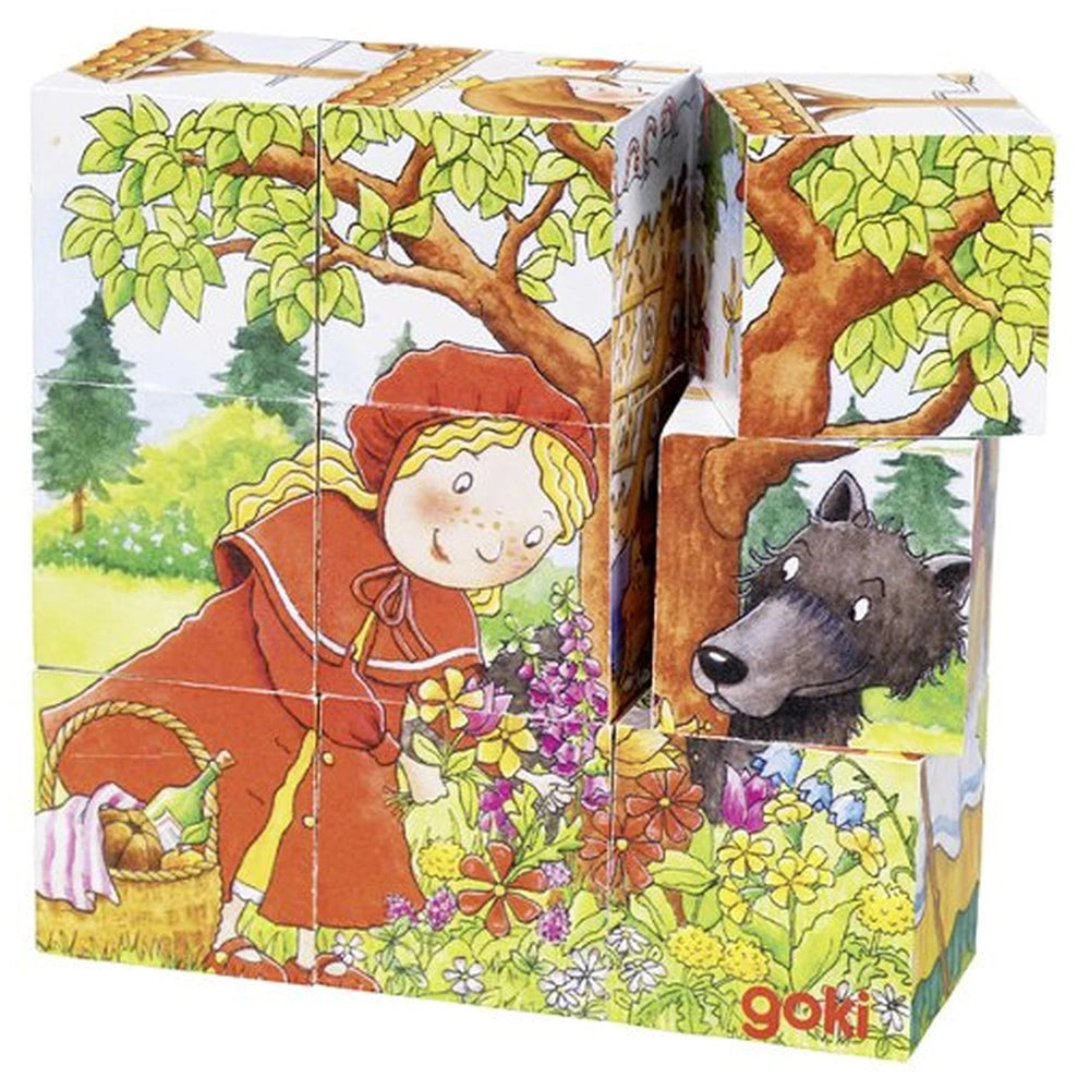 Gollness Fairy Tale Cube Puzzle packaging features a girl in a red dress with a wolf and flowers, displayed in a matte cardbo