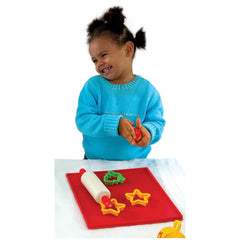 Gowi Baking Set Salzburg features a smiling child in a blue sweater holding a red object, surrounded by colorful play items.