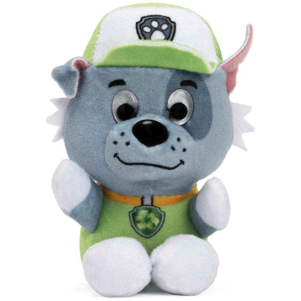 GUND PAW Patrol plush toy features a blue body, white paws, and a green cap, designed for a child's tactile experience.