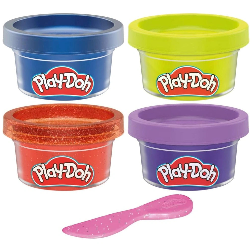 Hasbro Monster Mini Color 4 Pack features four glossy plastic containers in red, blue, yellow, and purple with a pink spoon.