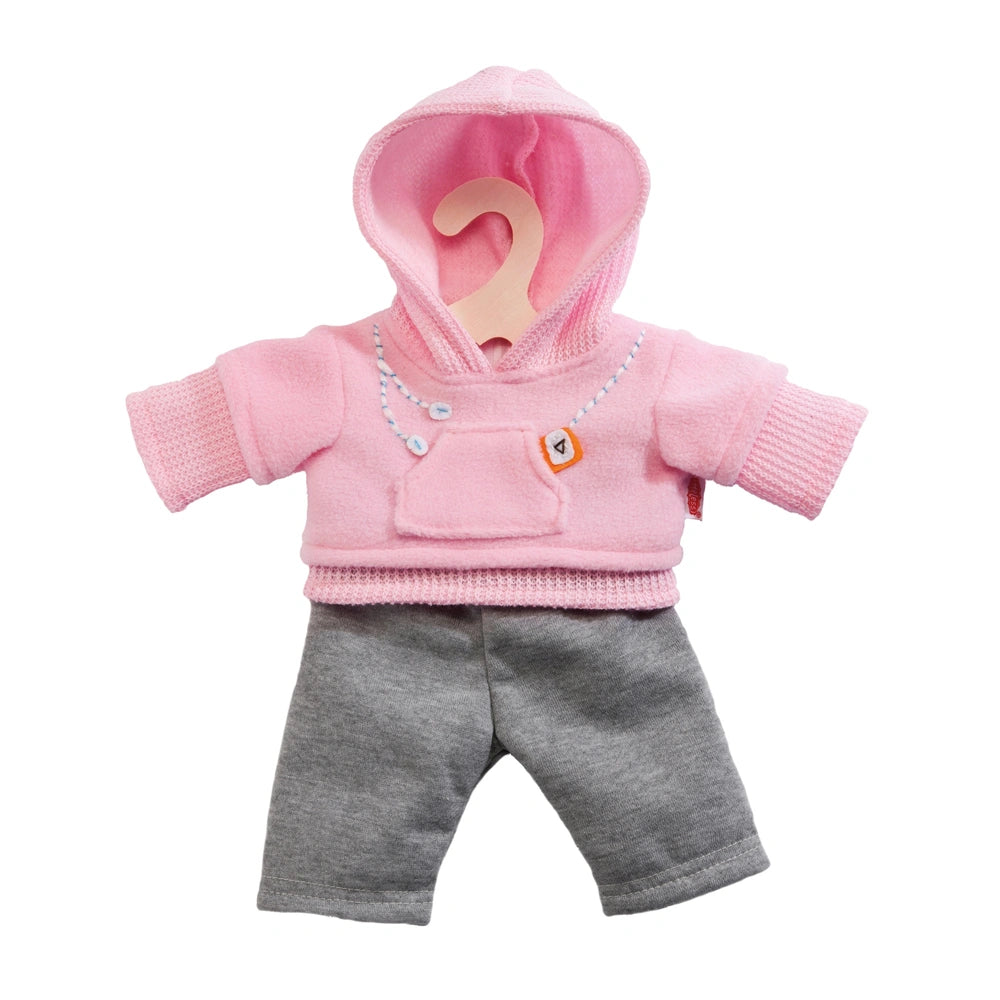 Heless jogging tracksuit for dolls, featuring a pink hoodie with zipper and orange tag, gray pants with pocket and white tag.