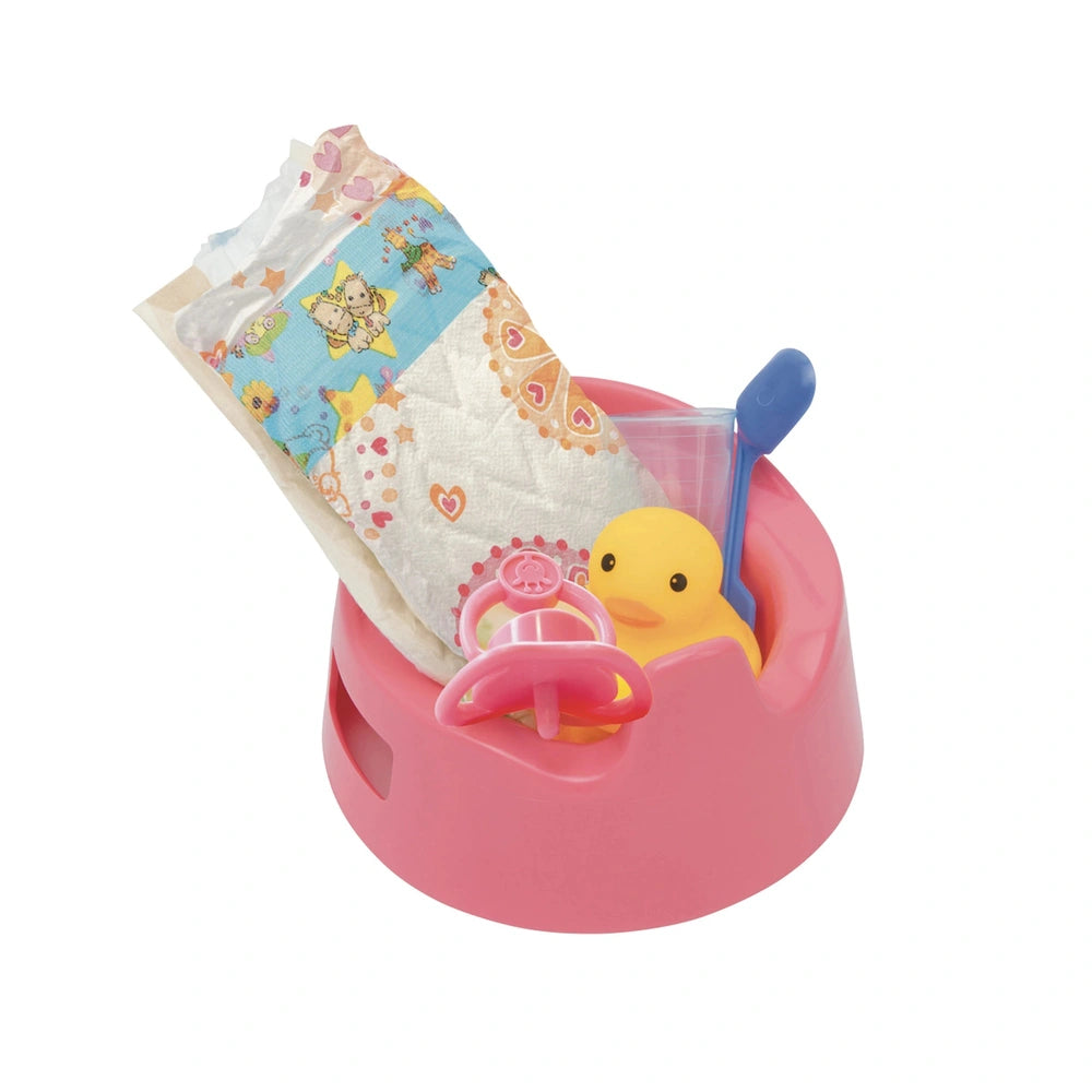Heless potty with accessories includes a plastic container, blue spoon, yellow and pink ducks, rattles, teether, bib, onesie,