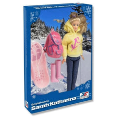 Jagerndorfer doll in yellow hoodie, blue pants, and pink boots, with blonde hair and accessories, packaged in blue glossy car