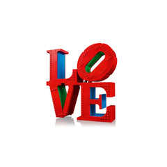 Lego construction set features the word "LOVE" in bold red letters, interlocked with vibrant blue and green bricks.