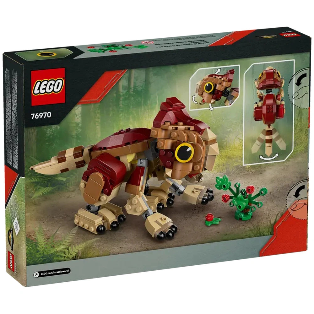 LEGO Baby Dinosaur Dolores, an Aquilops figure in vibrant colors, poses next to a buildable plant with flowers, set against a forest backdrop.