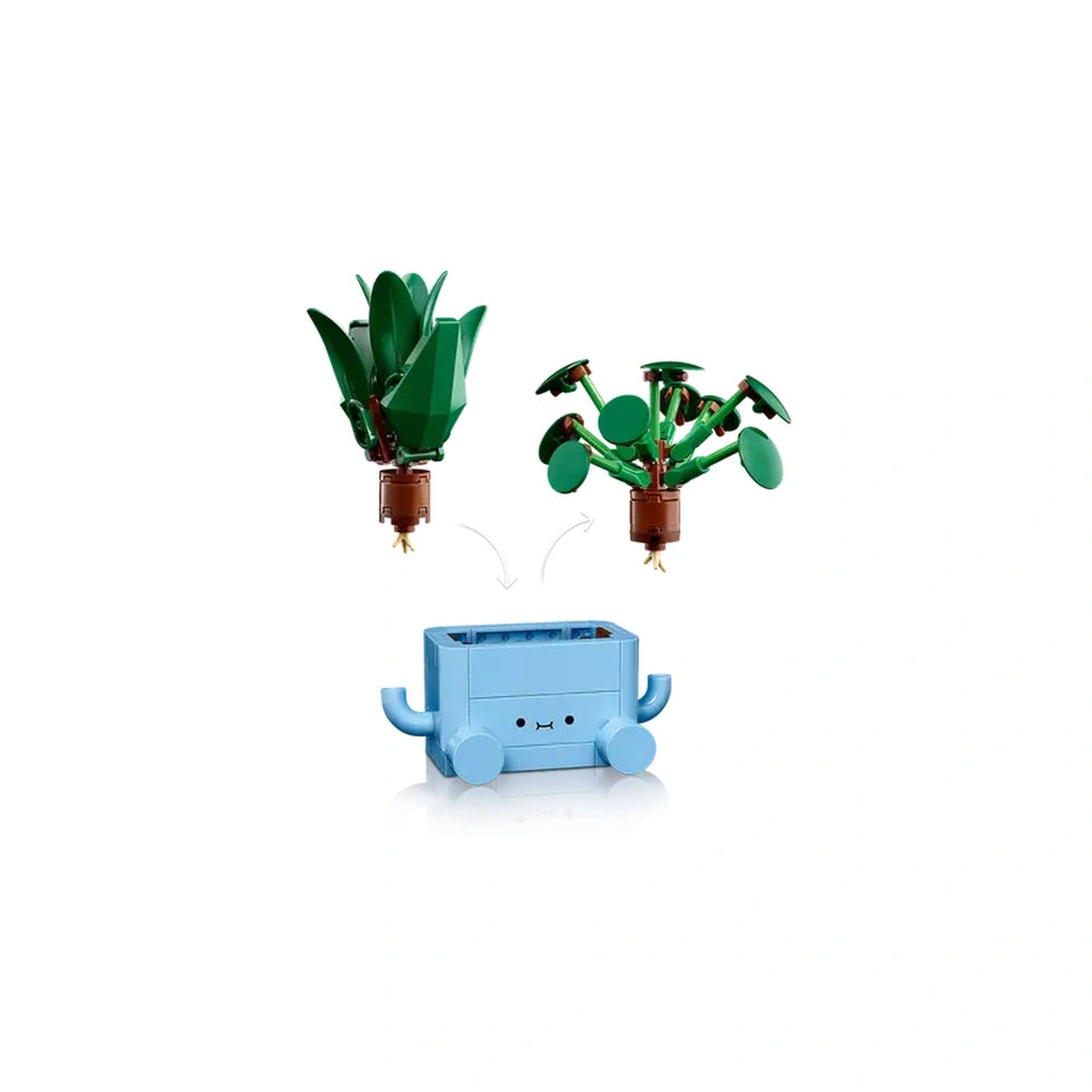 Two colorful LEGO indoor plants, a tall baby dracaena and a round baby pilea, above a cute blue pot with handles.