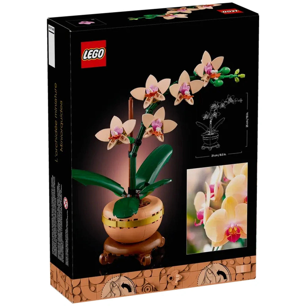 LEGO® Botanicals Mini Orchid set featuring five peach blooms, green leaves, and a light terracotta pot on a wooden base.