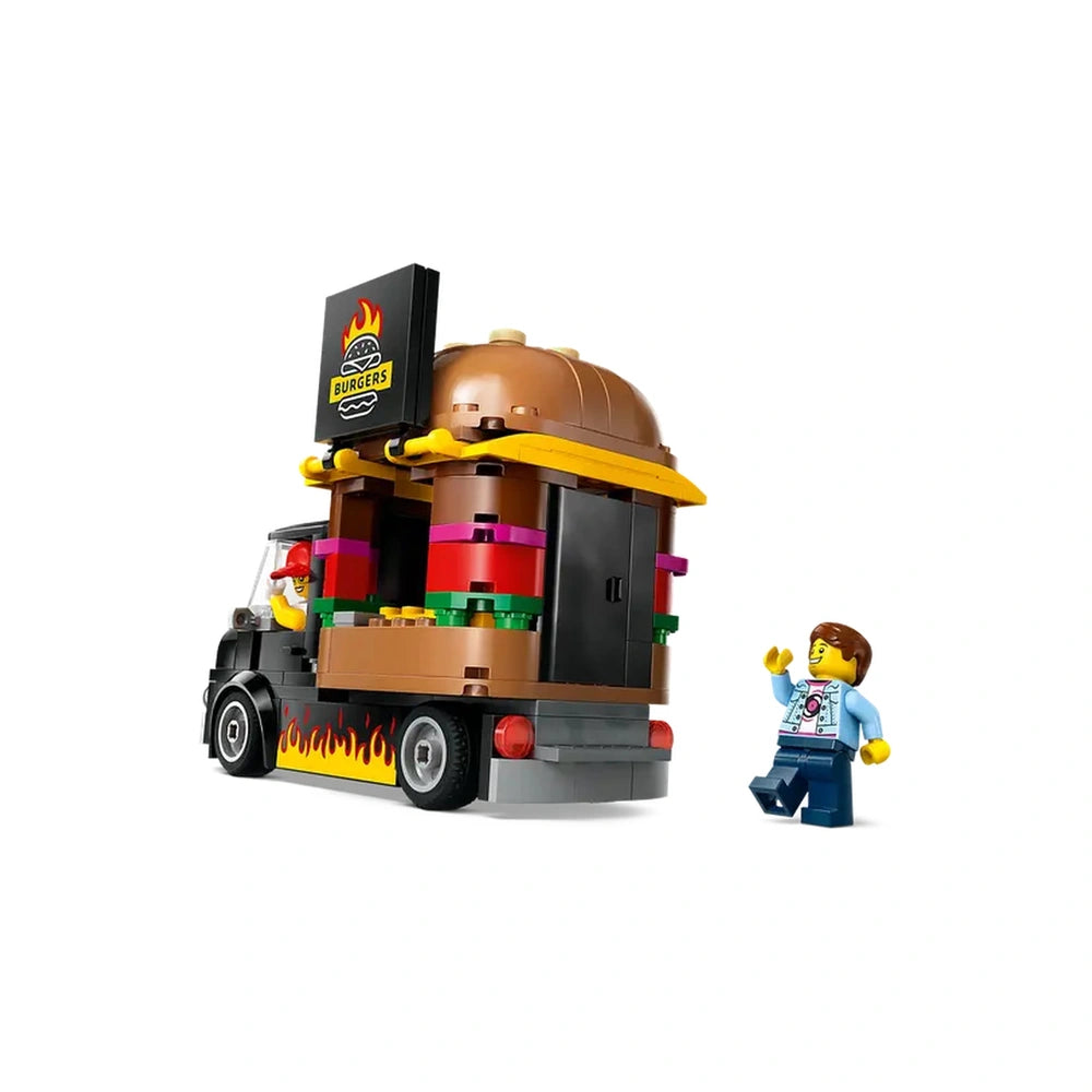 LEGO® City Burger Truck with a giant burger on top, featuring a vendor inside and a customer minifigure waving, vibrant colors.