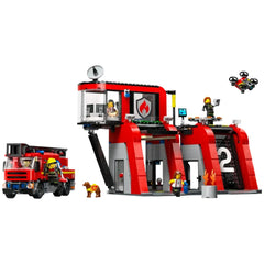 LEGO City Fire Station set with red building, fire truck, five firefighter minifigures, and a drone flying overhead.