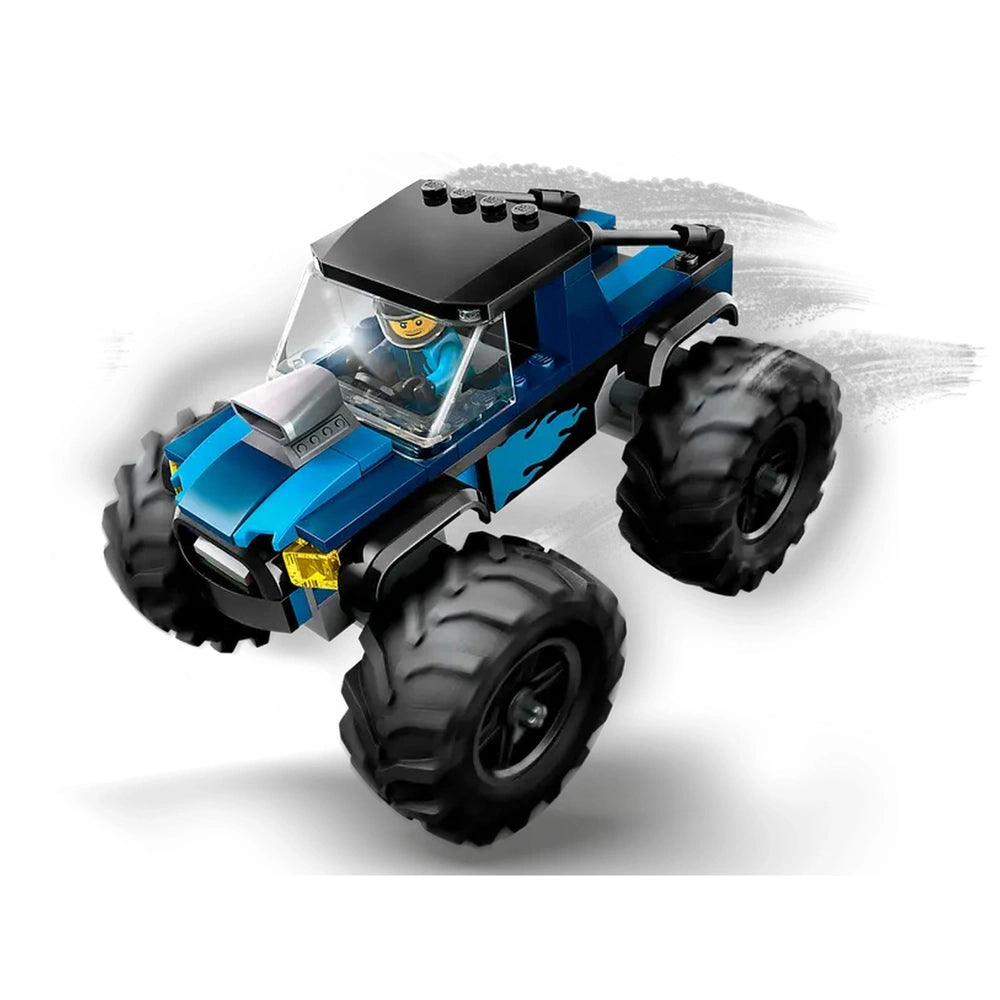 Blue LEGO® City Monster Truck with oversized black tires, featuring a driver minifigure in a transparent cabin, ready for adventures.