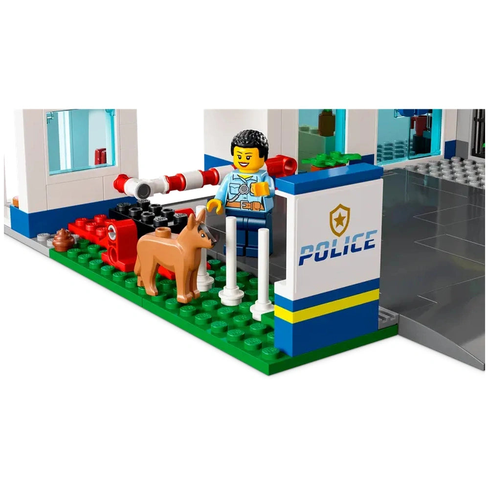LEGO® City Police Station features a police officer standing next to a friendly dog, with the police station backdrop showcasing detailed elements.