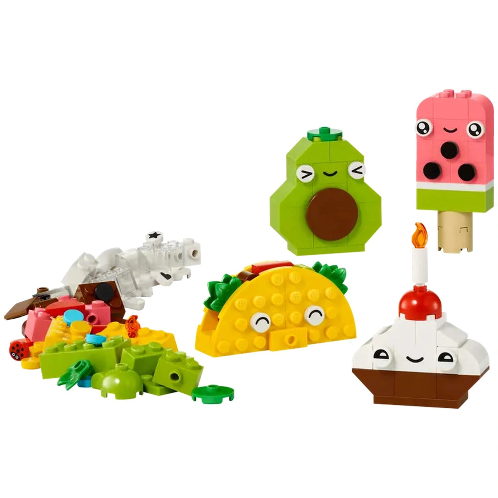 Colorful LEGO building bricks arranged to create four playful food characters: a smiling taco, a cheerful avocado, a cupcake with a cherry on top, and a pink ice cream pop. Various additional bricks are scattered around in vibrant colors, promoting creative play and storytelling for young builders.