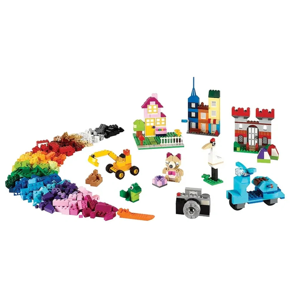 Colorful assortment of LEGO bricks in various shapes, featuring houses, vehicles, and a building site, demonstrating creativity and playfulness.