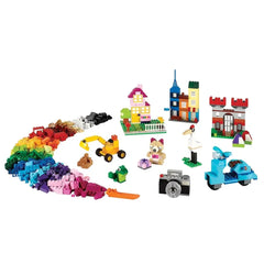 Colorful assortment of LEGO bricks in various shapes, featuring houses, vehicles, and a building site, demonstrating creativity and playfulness.