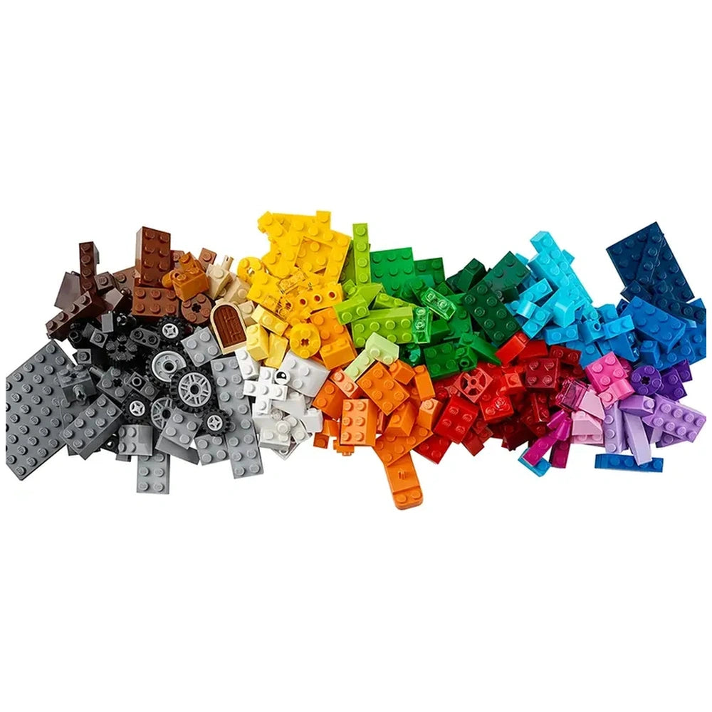 Colorful assortment of 484 LEGO bricks spread out in various shapes and sizes, featuring shades of gray, brown, yellow, green, red, blue, and purple. Ideal for imaginative play and creativity.