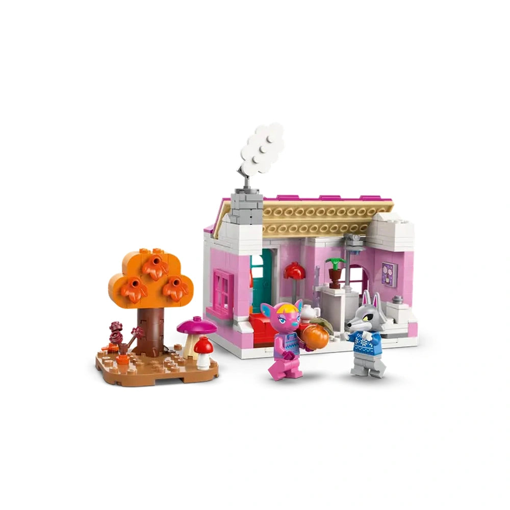 Colorful LEGO Creative Houses construction set featuring a pink house, an orange tree with pumpkins, and two playful animal figures.