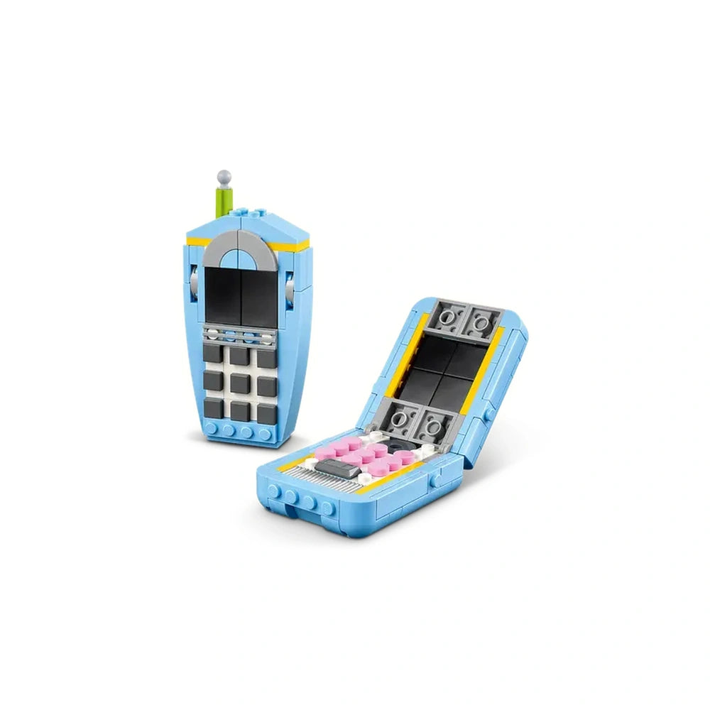 Retro LEGO construction set featuring a blue rotary telephone with a liftable receiver and colorful buttons, designed for imaginative play.
