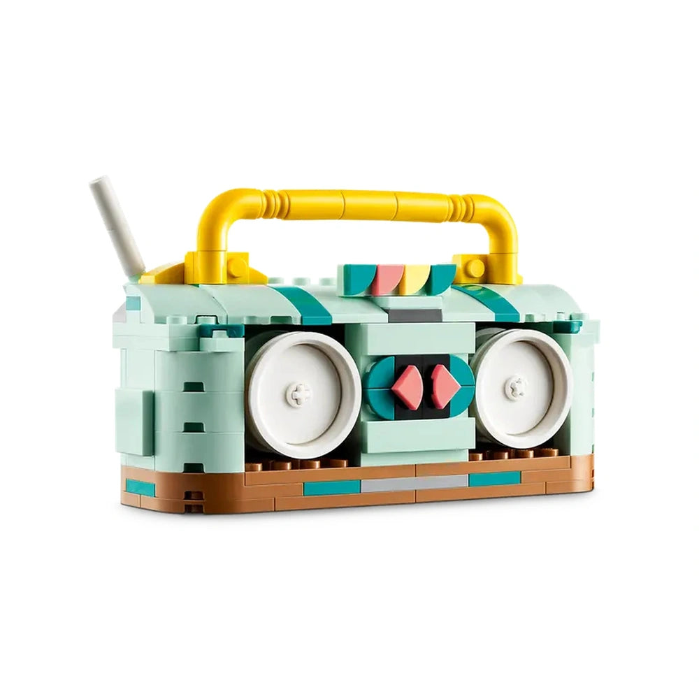 Colorful LEGO Creator Retro Roller Skate set shaped like a retro boombox, featuring pink wheels, a yellow handle, and decorative accents.