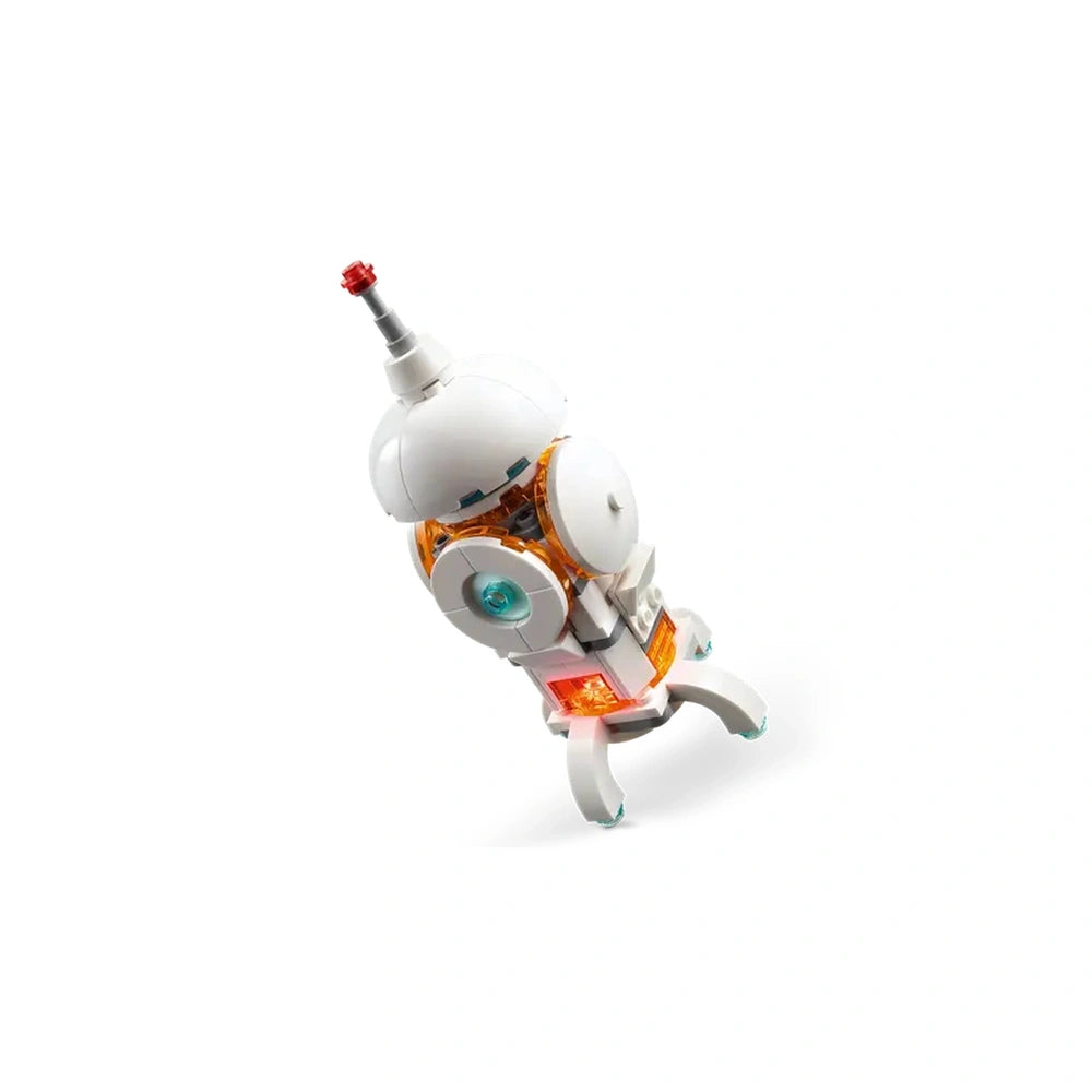 Interactive LEGO® Creator 3in1 Space Robot with a white and orange body, posable limbs, spinning head, and glowing chest, set against a plain background.