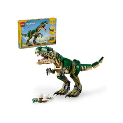 Lego Creator T. rex construction set featuring a green and beige articulated dinosaur with a detailed head and claws, alongside a nest with two white eggs.