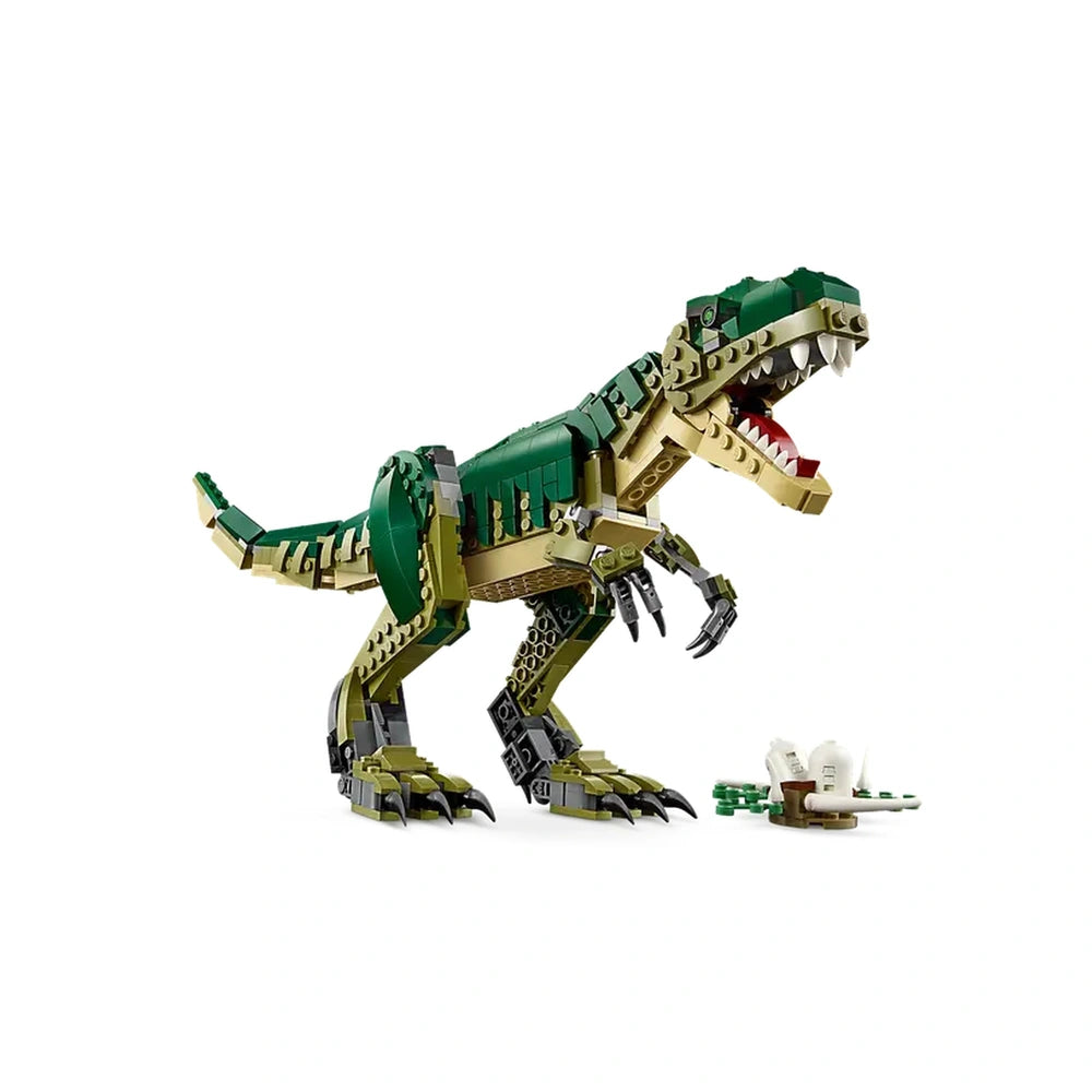 Green and tan LEGO T. rex dinosaur figure with articulated limbs and open jaws, standing next to a small nest containing dinosaur eggs.
