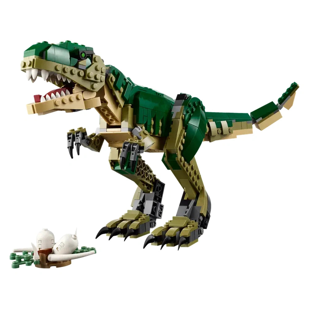 A vibrant LEGO Creator T. rex construction set in green and beige, featuring a highly posable Tyrannosaurus rex with detailed articulation. The dinosaur stands dynamically with its mouth open, showcasing sharp teeth. Next to it, a small nest contains two dinosaur eggs, enhancing the prehistoric play experience.