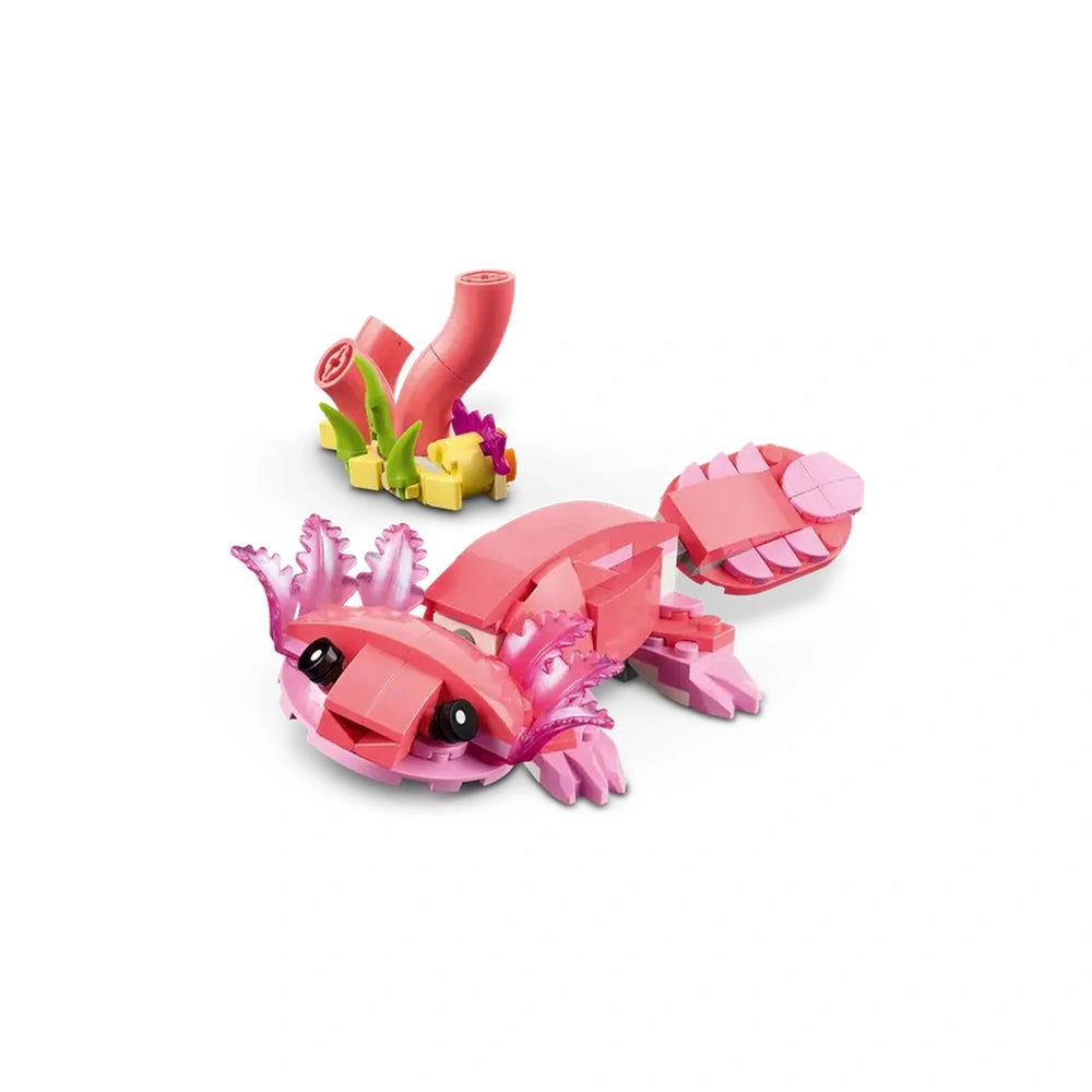Adorable pink axolotl construction toy featuring vibrant details and expressive eyes, set beside colorful underwater plants.