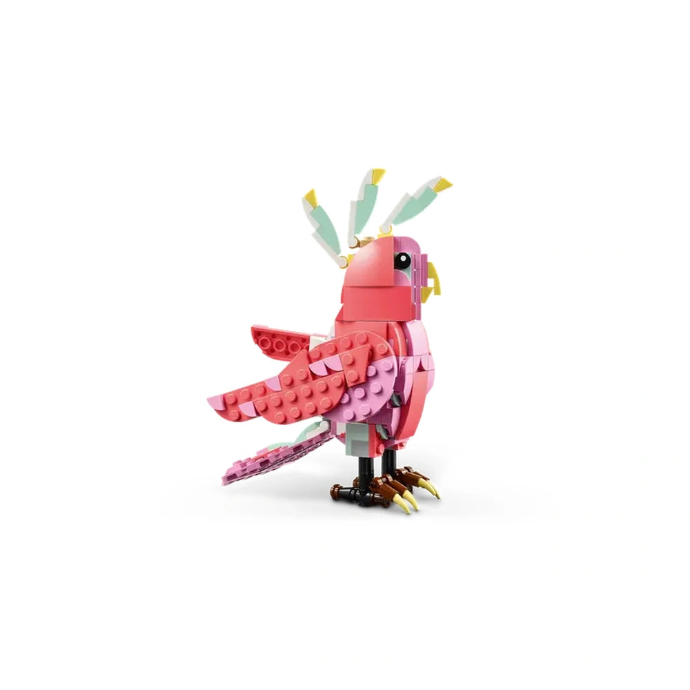 Colorful LEGO Creator pink cockatoo model, featuring a rotating head, perched on brown feet with vibrant wings and tail.