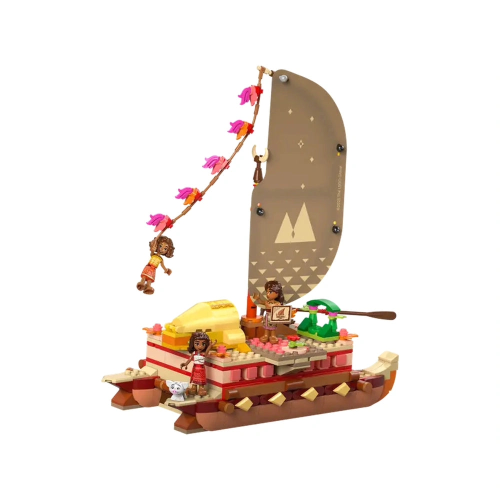 Moana's double-hulled canoe LEGO set features vibrant colors, a decorative sail, and two characters engaged in adventure.