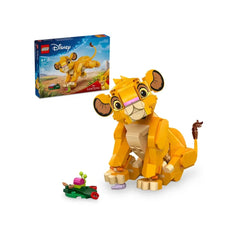 LEGO Disney Simba the Lion King Cub construction set, featuring a vibrant yellow Simba figure with movable legs, head, and tail, sitting beside a leaf build and colorful bug pieces, with the colorful box in the background.