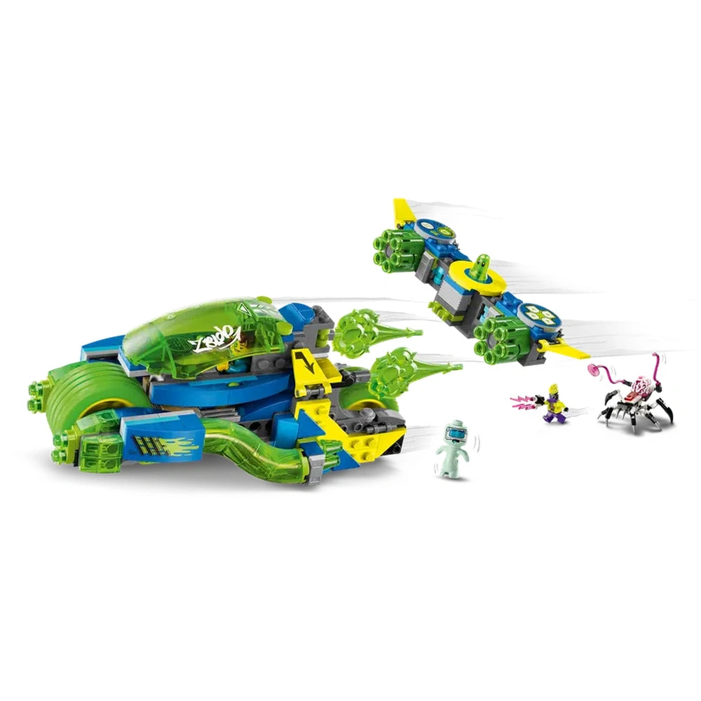 Colorful LEGO® DREAMZzz™ Mateo and the Z-Blob Action Race Car set features a sleek green and blue vehicle with yellow accents, equipped with multiple shooters. Accompanying the car are two small figures and a flying drone, all set against a white background.