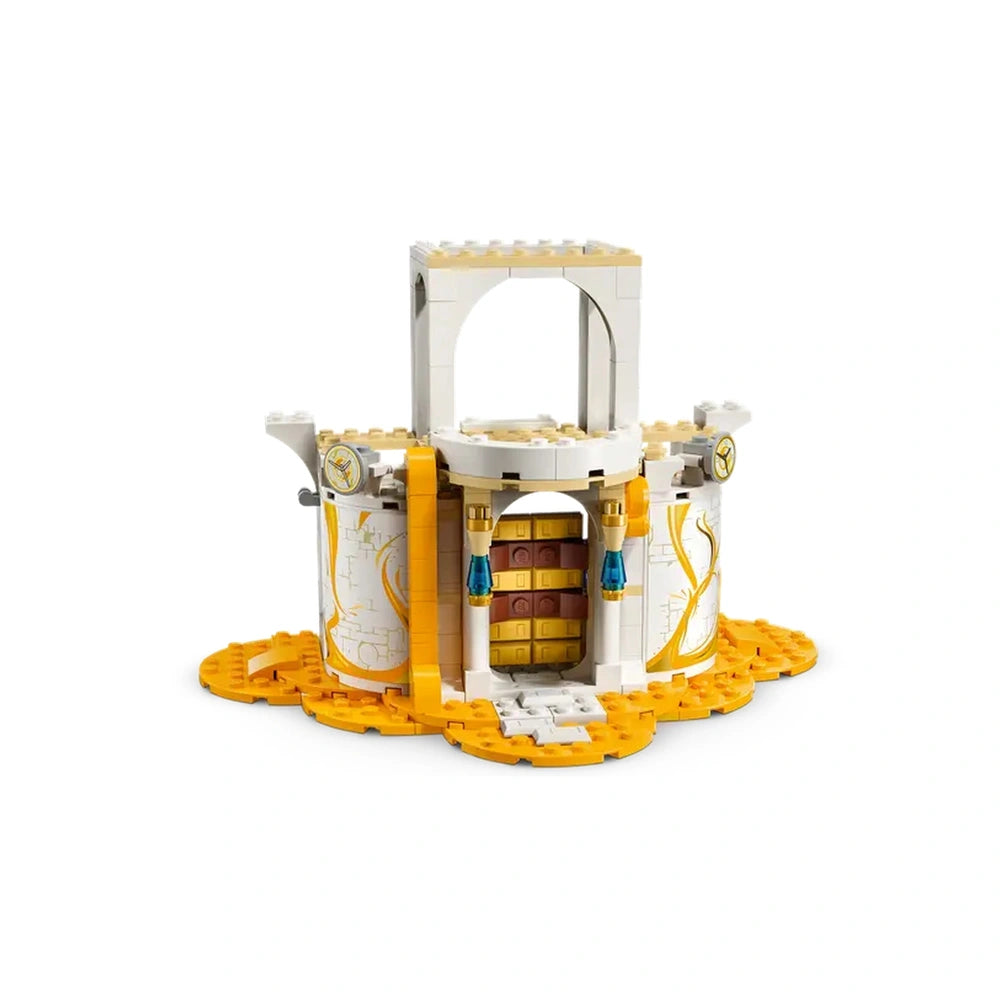 LEGO® DREAMZzz™ The Sandman's Tower, featuring a white and yellow castle with an arched entrance, intricate designs, and a unique hourglass cannon.