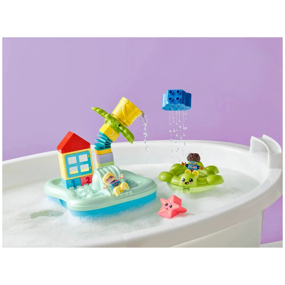 Colorful LEGO® DUPLO® Town Water Park set features a palm tree, water bucket, and playful figures riding a turtle floatie.
