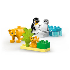 Set of LEGO® DUPLO® Wild Animal Families including two playful lions, two penguins, and colorful building blocks surrounded by greenery.
