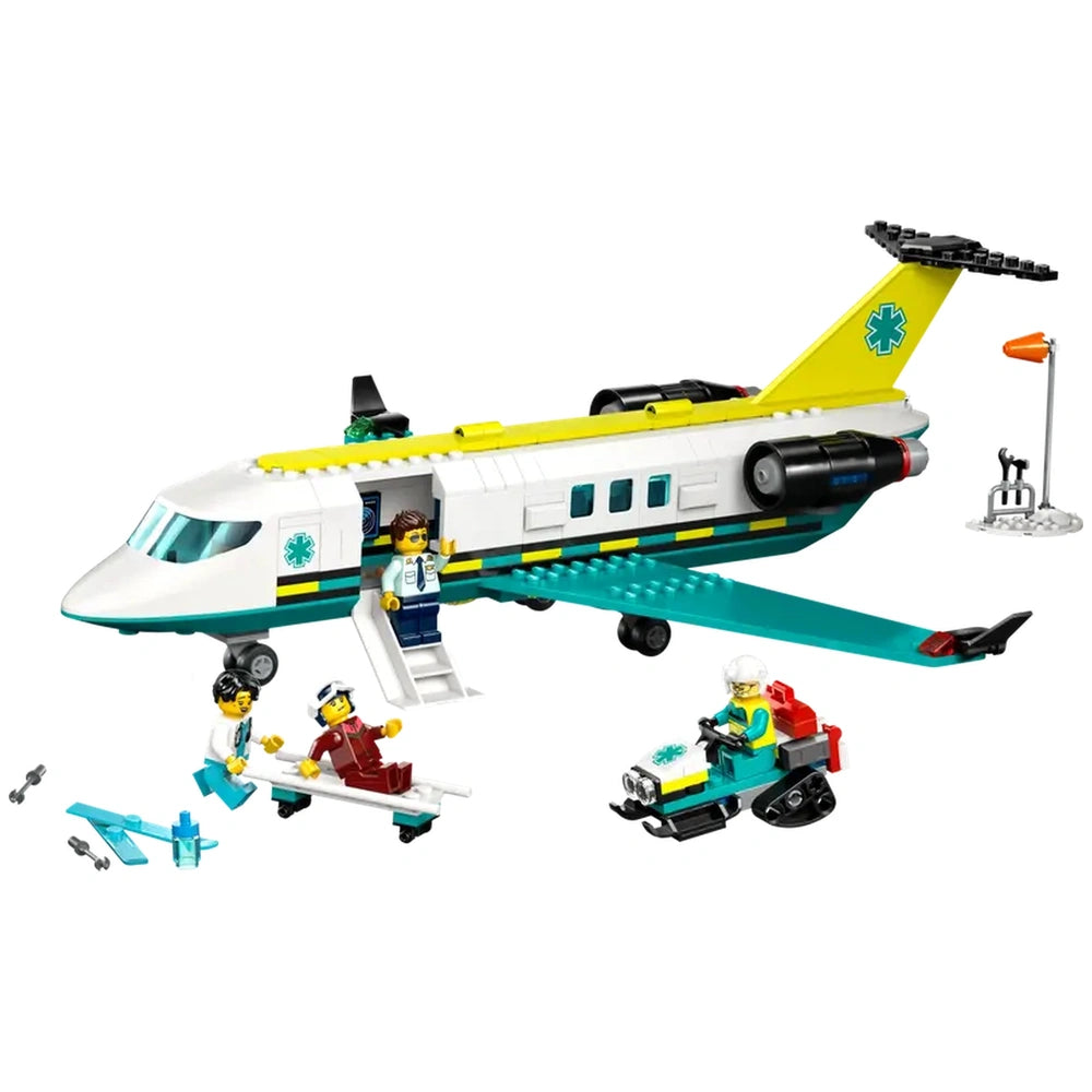 LEGO City Emergency Air Ambulance Plane in vibrant colors, featuring a twin-engine design, fold-down stairs, and minifigures of a pilot, doctor, and paramedic rescuing a skier on a stretcher. A toy snow scooter is nearby, along with an airport scene displaying a wind sock.