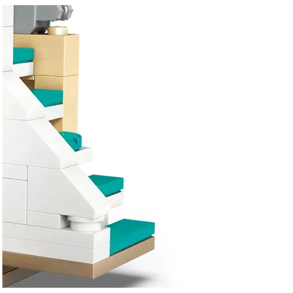 White LEGO stairs with turquoise steps lead up to a beige landing, showcasing intricate detailing typical of the Harry Potter playset.