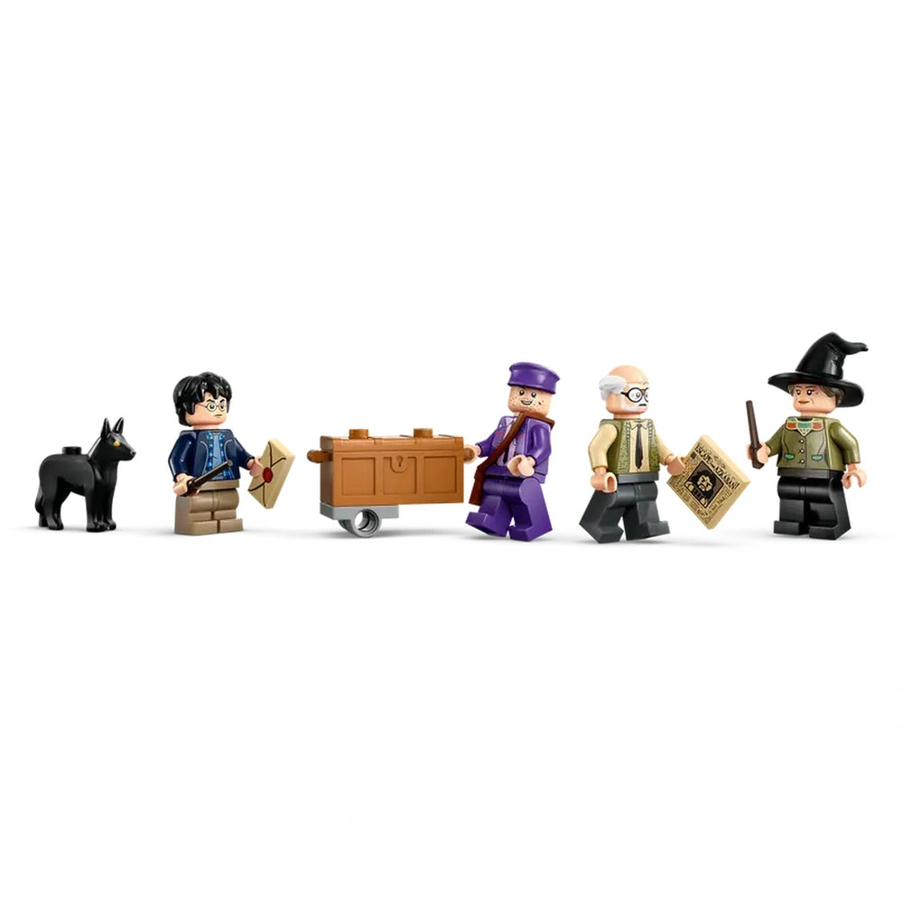 Five LEGO® figures from the Harry Potter™ universe: a young boy holding a letter, a black dog, a man pushing a cart, and two additional characters, one with a wand and wearing a witch's hat.