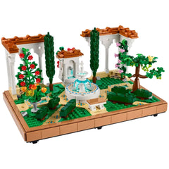 Lush LEGO® Icons Fountain Garden with a tiered fountain, colorful flowers, decorative pathways, and elegant pergolas.