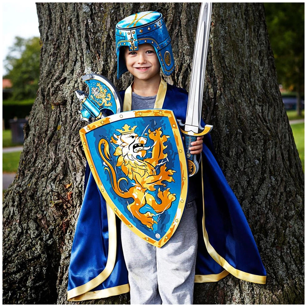Blue Liontouch knight helmet with gold trim, dark blue cape, and silver sword in a child's fantasy costume scene.