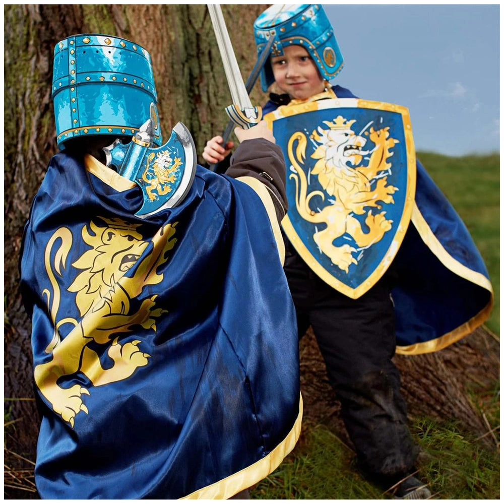 Liontouch blue knight sword with a child wearing a metallic blue helmet, cape, and shield in a playful lifestyle scene.