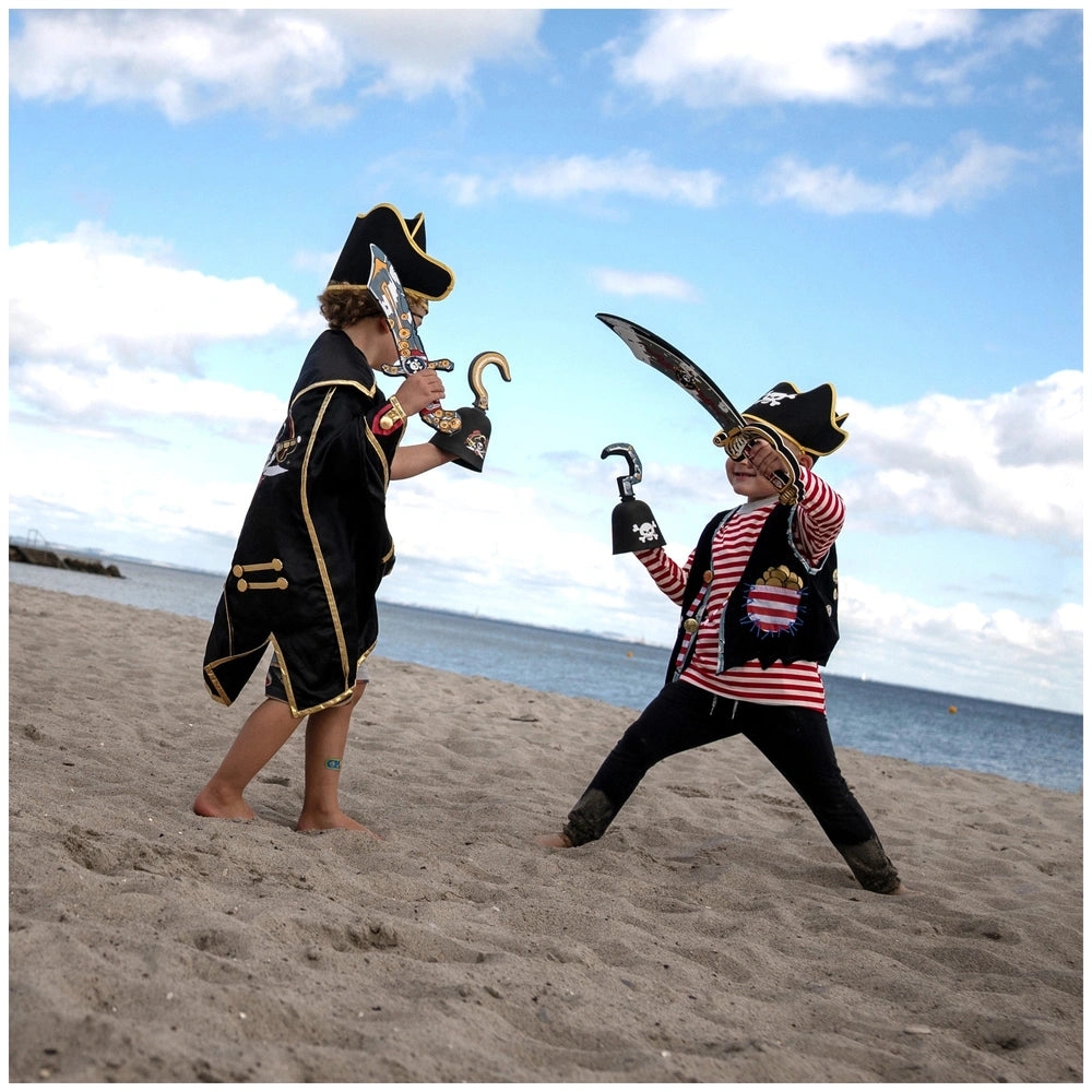 Liontouch Pirate Knife in a beach scene with two individuals in pirate costumes and hats, showcasing shiny black and gold mat