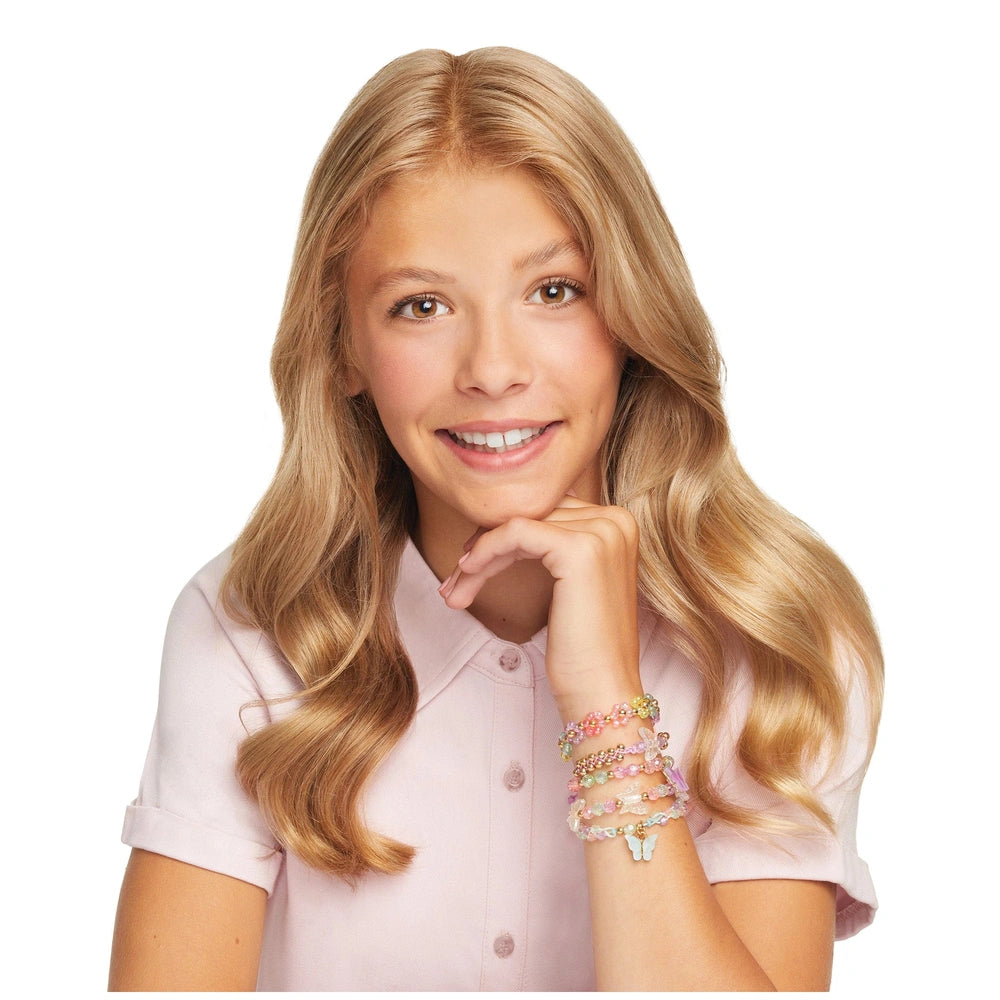 Butterfly jewelry set displayed in front view, featuring a blonde child wearing a pink shirt and light skin.
