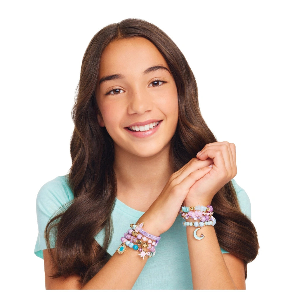 Multicolored Celestial Stones Bracelets worn by a smiling girl in a light blue top against a plain white background.