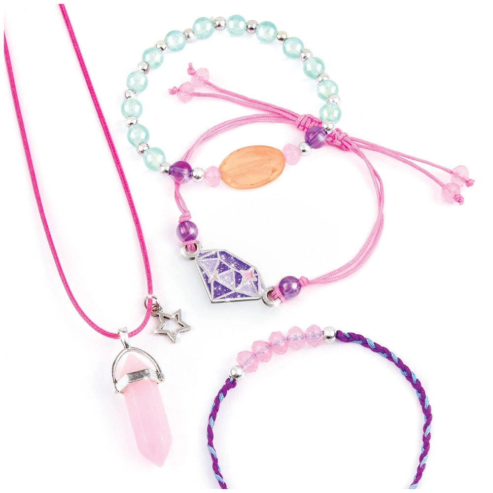 Positive Gems Jewelry features a pink cord necklace with a pink crystal pendant and a colorful bracelet with various beads.