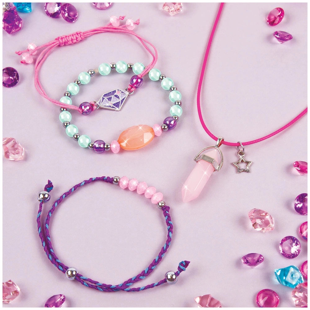 MAKE IT REAL Positive Gems Jewelry features a colorful bracelet with pink, blue, and purple cords and beads arranged centrall