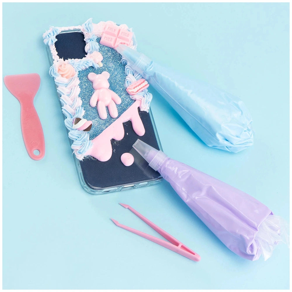 Momomi Decoden Kawaii Artist creamy phone cover features a glossy light blue surface with decorative patterns and pink-handle