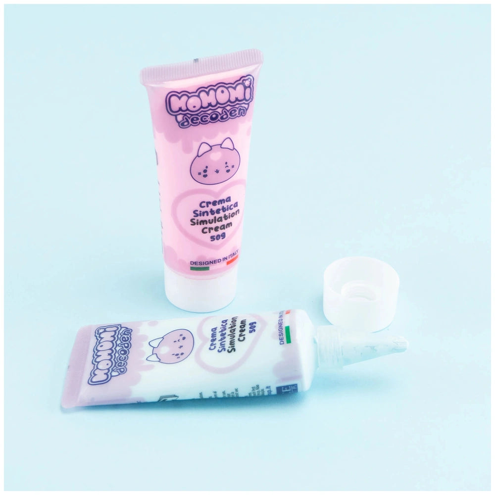 Momomi Decoden Kawaii Artist Creamy Phone Cover Starter Pack with pink and white tube, matte packaging, and bow-adorned cap.