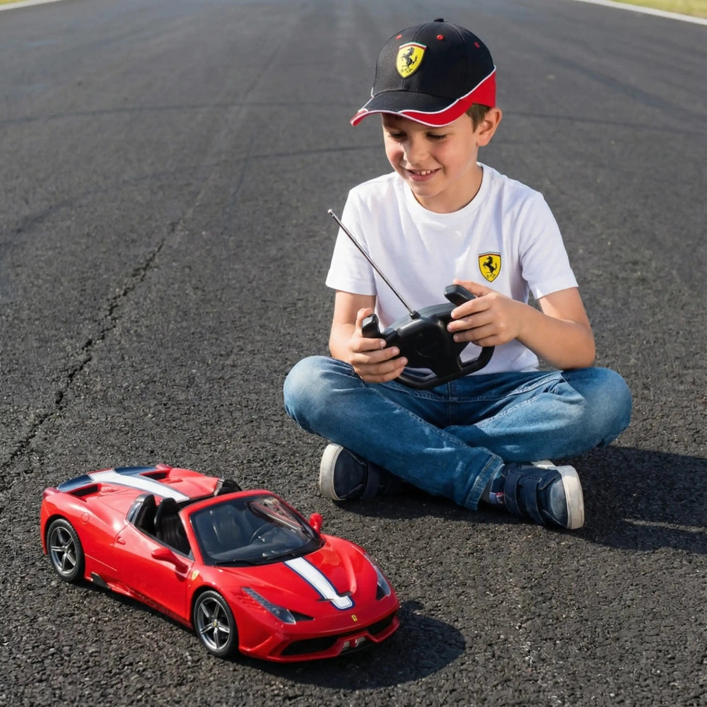 Mondo Farrari 458 Speciale A radio-controlled car is controlled by a boy in a black cap and colorful t-shirt on asphalt.